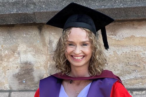 Head shot of Mel de Lange at her PhD graduation outside the Wills Memorial Building